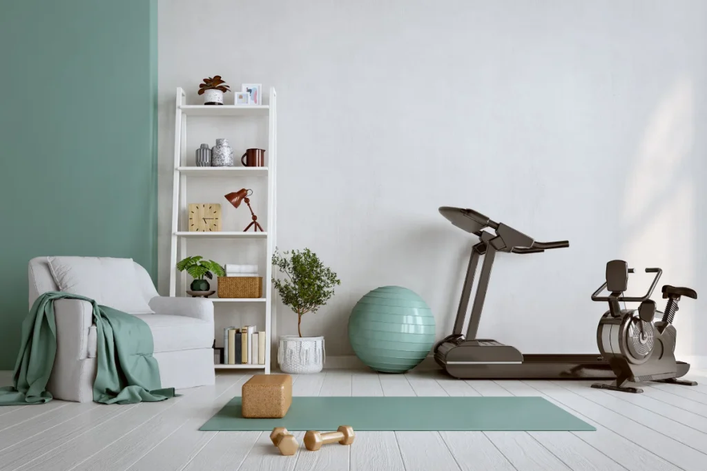 A room in a home with exercise equipment and furniture.